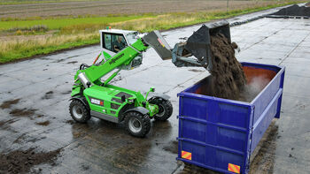 SENNEBOGEN telehandler 355 E loading of compost in container composting plant elevating cab shovel