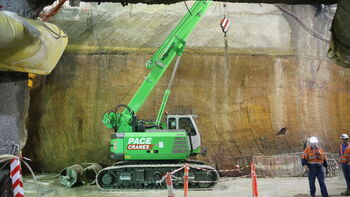 A telescopic crawler crane underground: SENNEBOGEN 613 crawler works under the Sydney Opera House