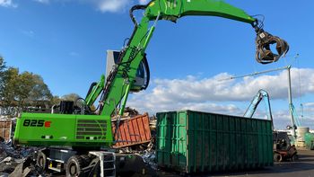 Material handling machine with tool-change capability for grab and scrap shear Material handling machine with tool-change capability for grab and scrap shear
